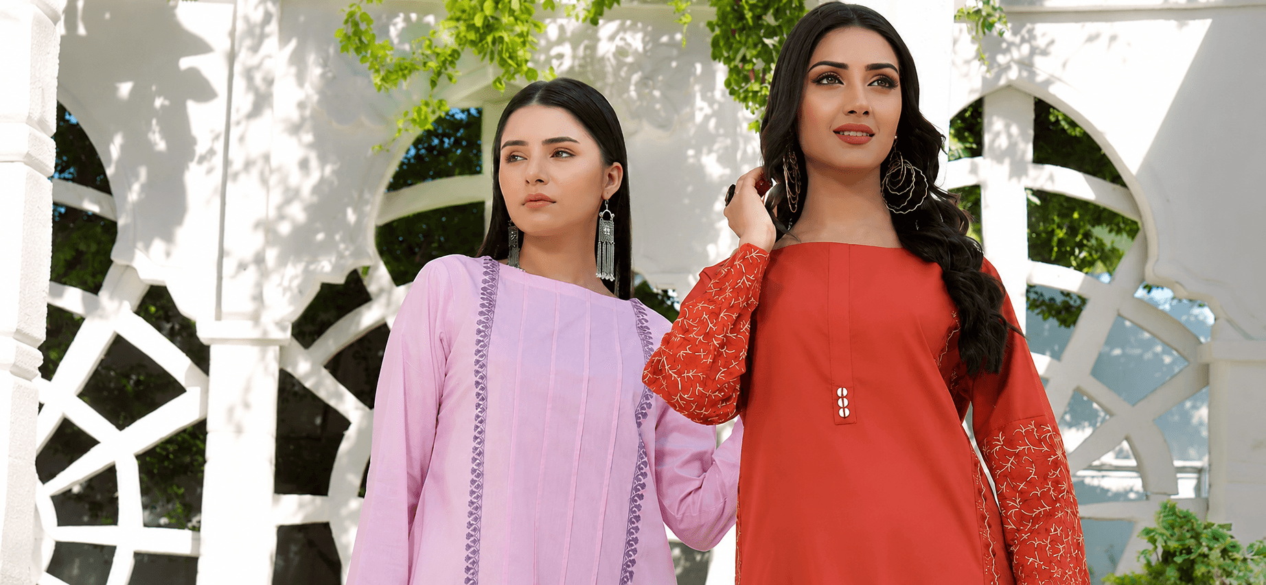 Two women wearing Weavon unstitched suits